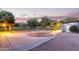 Backyard patio featuring custom concrete work, with a stunning sunset at 645 S Esquire Way, Mesa, AZ 85202