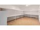 Spacious walk-in closet featuring built in shelving and a neutral tiled floor at 645 S Esquire Way, Mesa, AZ 85202