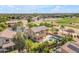 Stunning backyard oasis with a pool, covered patio, and well-maintained landscaping in a beautiful Arizona home at 704 E Gemini Pl, Chandler, AZ 85249
