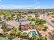 Aerial view of house with a backyard featuring a pristine pool and lush landscaping in a residential area at 704 E Gemini Pl, Chandler, AZ 85249