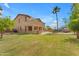 Expansive backyard view of the home, patio, and landscaping at 704 E Gemini Pl, Chandler, AZ 85249