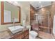 Modern bathroom featuring a glass shower enclosure, rain showerhead, and vessel sink at 704 E Gemini Pl, Chandler, AZ 85249