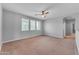 Spacious bedroom with neutral walls, carpet, and large windows providing plenty of light at 704 E Gemini Pl, Chandler, AZ 85249