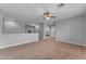 Large bonus room with carpet, neutral walls, and an open floor plan at 704 E Gemini Pl, Chandler, AZ 85249