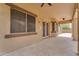 Large covered patio with stone flooring and access to the backyard at 704 E Gemini Pl, Chandler, AZ 85249