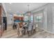 Elegant dining room with a modern chandelier, wood floors, and neutral decor, perfect for entertaining guests at 704 E Gemini Pl, Chandler, AZ 85249