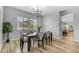 Cozy dining room featuring a classic chandelier and wood floors, creating a welcoming space for meals at 704 E Gemini Pl, Chandler, AZ 85249