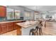 Spacious open kitchen featuring a central island, wood cabinets, and stainless steel appliances at 704 E Gemini Pl, Chandler, AZ 85249