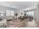 Bright living room with neutral furnishings, wood floors, and an open layout, ideal for relaxation and gatherings at 704 E Gemini Pl, Chandler, AZ 85249