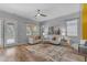 Comfortable living room with neutral decor, wood floors, and ample natural light at 704 E Gemini Pl, Chandler, AZ 85249