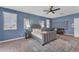 Comfortable main bedroom with a ceiling fan, area rug, and modern design at 704 E Gemini Pl, Chandler, AZ 85249