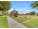 Community playground with mature trees and play equipment creates a great space for fun and recreation at 704 E Gemini Pl, Chandler, AZ 85249