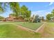 Community playground with mature trees and play equipment creates a great space for fun and recreation at 704 E Gemini Pl, Chandler, AZ 85249