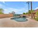 Stunning pool with a rock waterfall and travertine decking at 704 E Gemini Pl, Chandler, AZ 85249