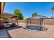 Backyard featuring a trampoline, patio, and barbecue grill at 7346 E Naranja Ave, Mesa, AZ 85209