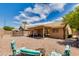 Spacious backyard with patio, seating, and a trampoline at 7346 E Naranja Ave, Mesa, AZ 85209