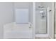Bathroom featuring a soaking tub and separate glass shower at 7346 E Naranja Ave, Mesa, AZ 85209