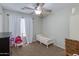 Bright bedroom with neutral walls, ceiling fan, and carpet floor at 7346 E Naranja Ave, Mesa, AZ 85209
