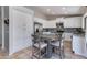 Eat-in kitchen featuring a table and chairs, stainless steel appliances, and white cabinets at 7346 E Naranja Ave, Mesa, AZ 85209