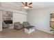 Comfortable living room featuring carpet flooring, neutral tones, and comfortable seating arrangements at 7346 E Naranja Ave, Mesa, AZ 85209