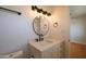 Modern bathroom with a round mirror, stylish vanity, and vanity lighting at 749 E Montebello Ave # 231, Phoenix, AZ 85014