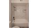 Updated bathroom showcases a white bathtub with white marble tile surround at 749 E Montebello Ave # 231, Phoenix, AZ 85014