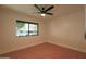 Cozy bedroom with wood floors, a modern ceiling fan and a large window at 749 E Montebello Ave # 231, Phoenix, AZ 85014
