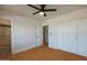 Bright bedroom with a ceiling fan, hardwood flooring and large closet at 749 E Montebello Ave # 231, Phoenix, AZ 85014