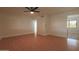 Spacious living room featuring wood floors and a modern ceiling fan at 749 E Montebello Ave # 231, Phoenix, AZ 85014