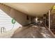 Spacious carport with concrete flooring and access to hookups at 7654 E Calypso Ave, Mesa, AZ 85208