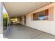 Spacious carport with concrete flooring offering ample parking at 7654 E Calypso Ave, Mesa, AZ 85208