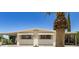 Charming home with covered carport and desert landscaping at 7654 E Calypso Ave, Mesa, AZ 85208