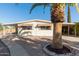 Charming home featuring mature landscaping, sidewalk, and attached carport at 7654 E Calypso Ave, Mesa, AZ 85208