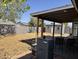 Covered patio and large backyard with block wall and a storage shed at 822 W El Alba Way, Chandler, AZ 85225