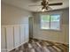 Bedroom featuring paneled walls, a large window, and door at 822 W El Alba Way, Chandler, AZ 85225