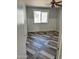 Bedroom featuring wood-look floors, a ceiling fan, and wainscoting details at 822 W El Alba Way, Chandler, AZ 85225