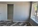 This bedroom has a window, closet, and stylish floors at 822 W El Alba Way, Chandler, AZ 85225