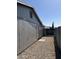 Side view of a gray painted detached garage in a backyard with gravel at 822 W El Alba Way, Chandler, AZ 85225