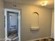Hallway with decorative alcove and stylish multi-tone wood-look flooring; leads to a storage area at 822 W El Alba Way, Chandler, AZ 85225