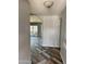 Hallway featuring decorative flooring and leading into an open floor plan with an archway and patio door at 822 W El Alba Way, Chandler, AZ 85225