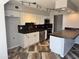 Modern kitchen featuring stainless steel appliances, white cabinets, concrete countertops, and stylish flooring at 822 W El Alba Way, Chandler, AZ 85225