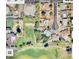 A wide aerial shot shows the property's proximity to a nearby golf course and other residences at 8402 N 105Th Ln, Peoria, AZ 85345