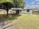 A spacious backyard features a covered patio and lush lawn at 8402 N 105Th Ln, Peoria, AZ 85345