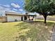 A spacious backyard features a covered patio and lush lawn at 8402 N 105Th Ln, Peoria, AZ 85345
