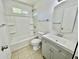 All-white bathroom featuring a shower and tub, a modern sink with vanity at 8402 N 105Th Ln, Peoria, AZ 85345