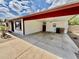 Spacious carport providing covered parking and storage space, with house access at 8402 N 105Th Ln, Peoria, AZ 85345