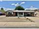 Charming single-story home with a covered carport and low maintenance desert landscaping at 8402 N 105Th Ln, Peoria, AZ 85345