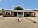 Charming single-story home with a covered carport and low maintenance desert landscaping at 8402 N 105Th Ln, Peoria, AZ 85345