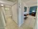 Hallway with bathroom and view to living room at 8402 N 105Th Ln, Peoria, AZ 85345