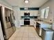 Clean kitchen with stainless steel appliances, granite countertops, and a window for natural light at 8402 N 105Th Ln, Peoria, AZ 85345